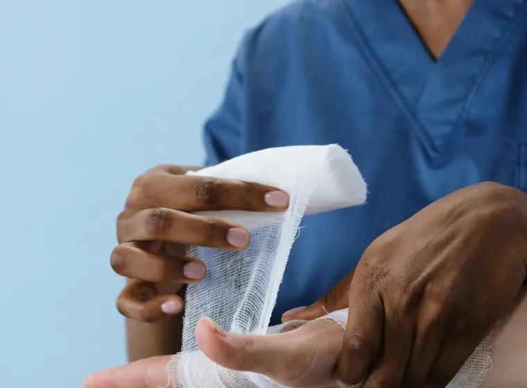 Clinician treating an injured hand